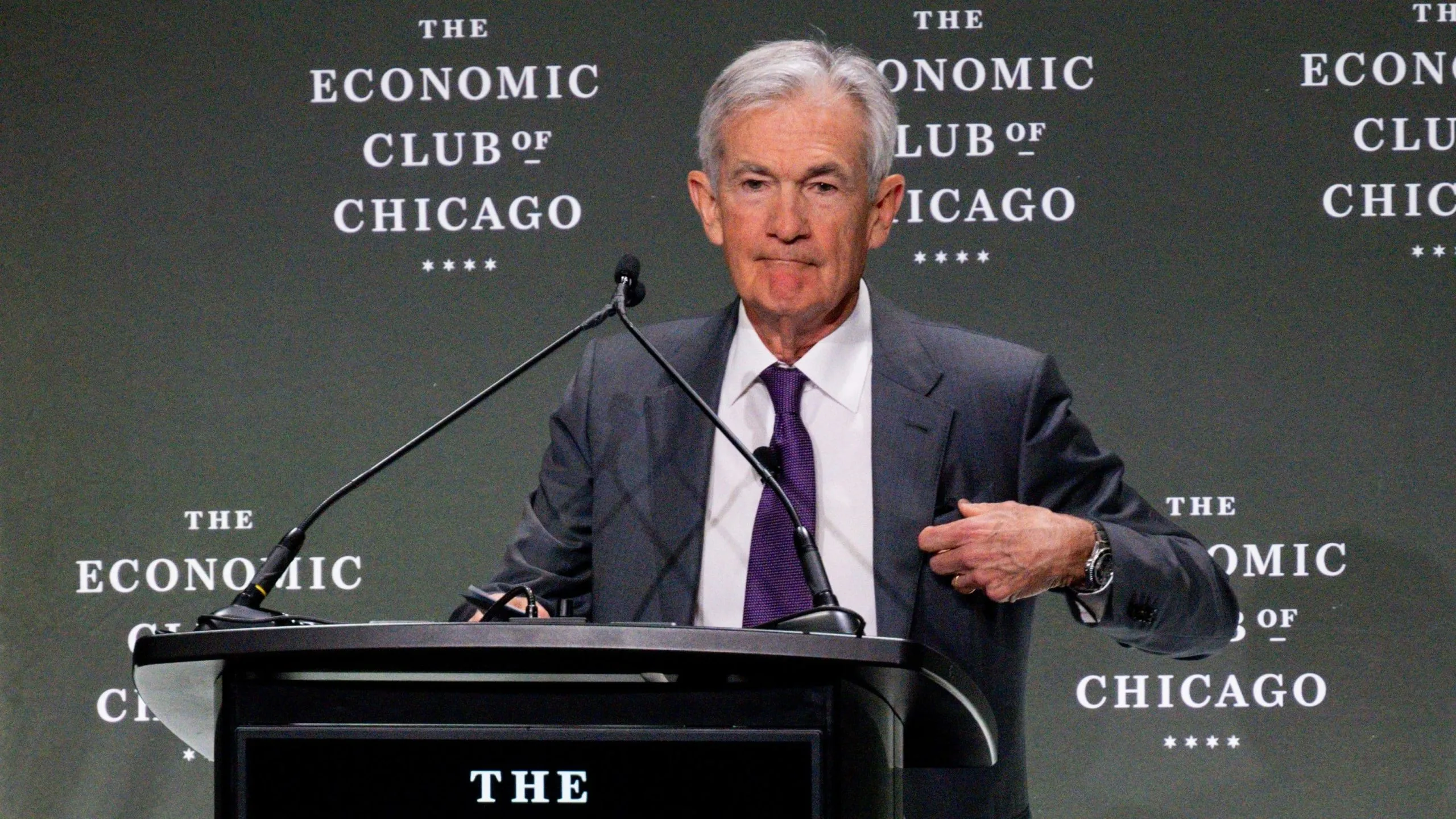 Fed Chair Jerome Powell stands at a lectern during an Economic Club of Chicago event.