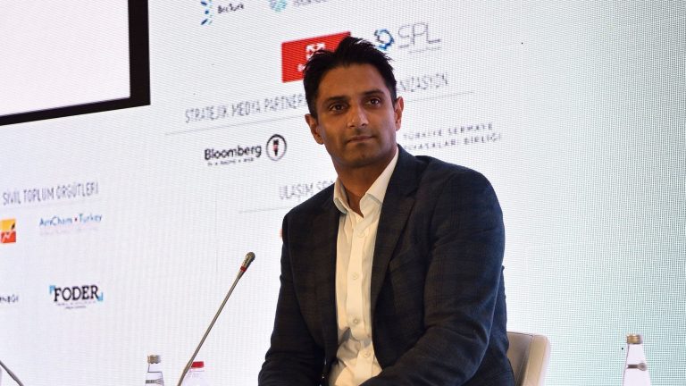 Libre CEO Avtar Sehra sits on a chair in front of a microphone (Libre)