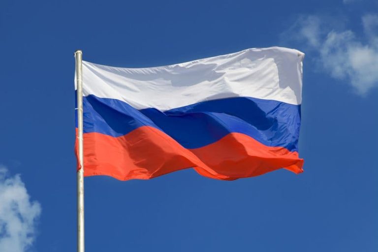 The Russian flag waves against an almost cloudless sky. (CoinDesk archives)