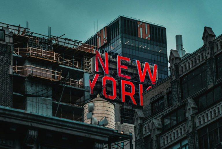 New York written on a building (Nik Shuliahin/Unsplash)