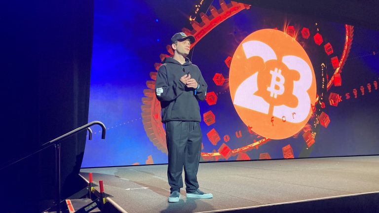 Jack Mallers, founder and CEO of Strike, stands on a stage at Bitcoin 2023. (Frederick Munawa)