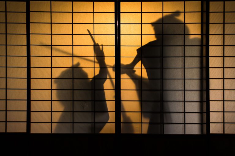 Silhouette of two samurai fighting (YS graphic/Getty Images)