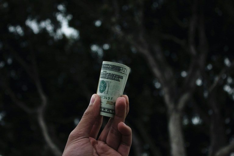 Money rolled up (Vitaly Taranov/Unsplash)
