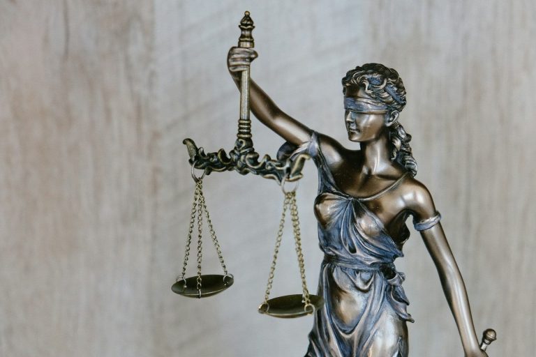 Lady Justice (Tingey Injury Law Firm/Unsplash)
