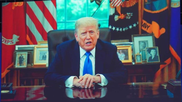 Donald Trump speaks from his desk in recorded video