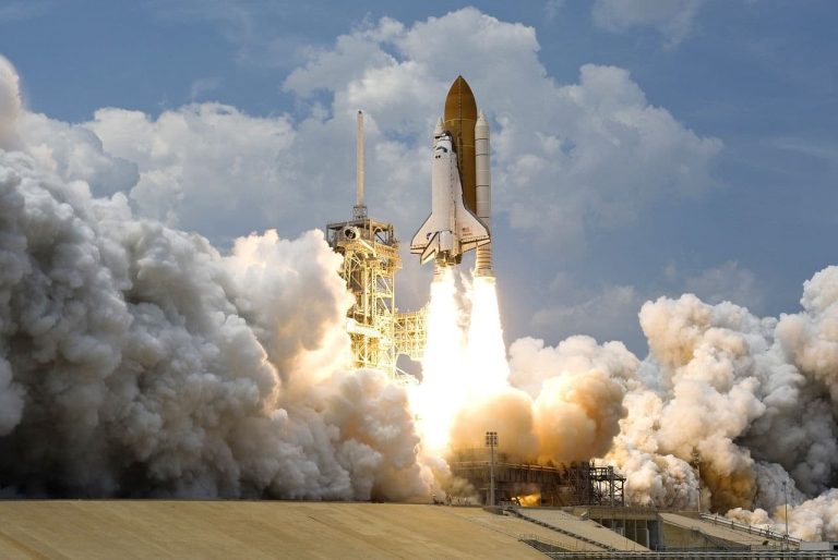 A space shuttle takes off on the back of a rocket. (WikiImages/Pixabay)