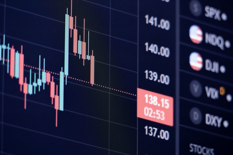 Stock trading chart next to watchlist (Tötös Ádám/Unsplash)