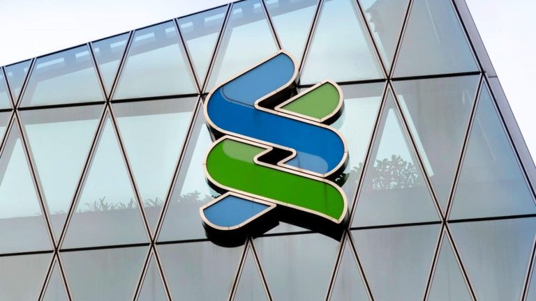 Standard Chartered logo on the side of a building.