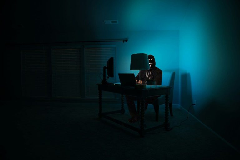 Hacker sitting in a room