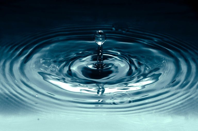 Close-up of a water droplet creating ripples