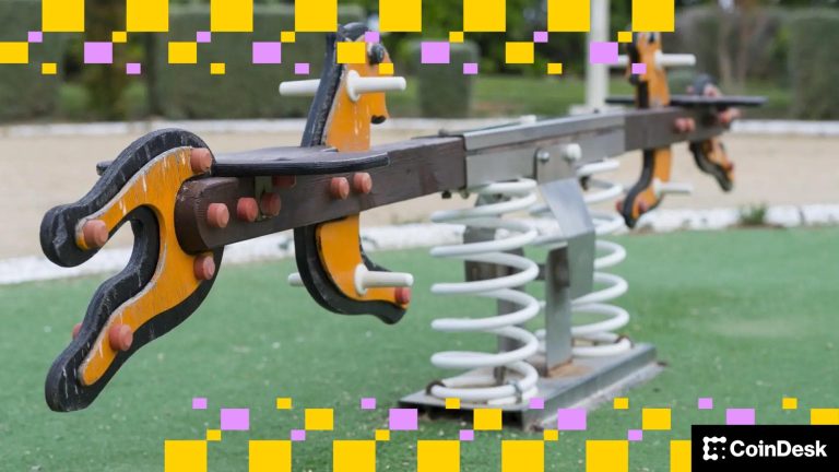 A see-saw sits unused in a playground